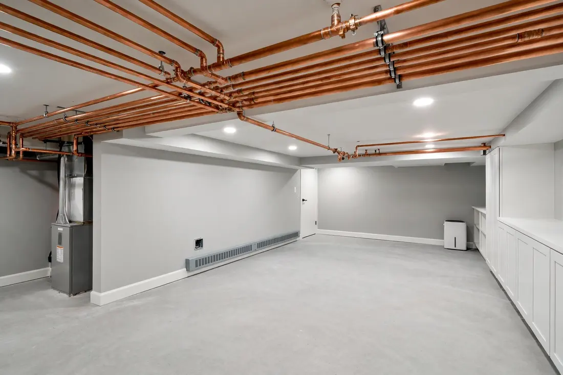 The same basement dry and restored after the burst pipe repair